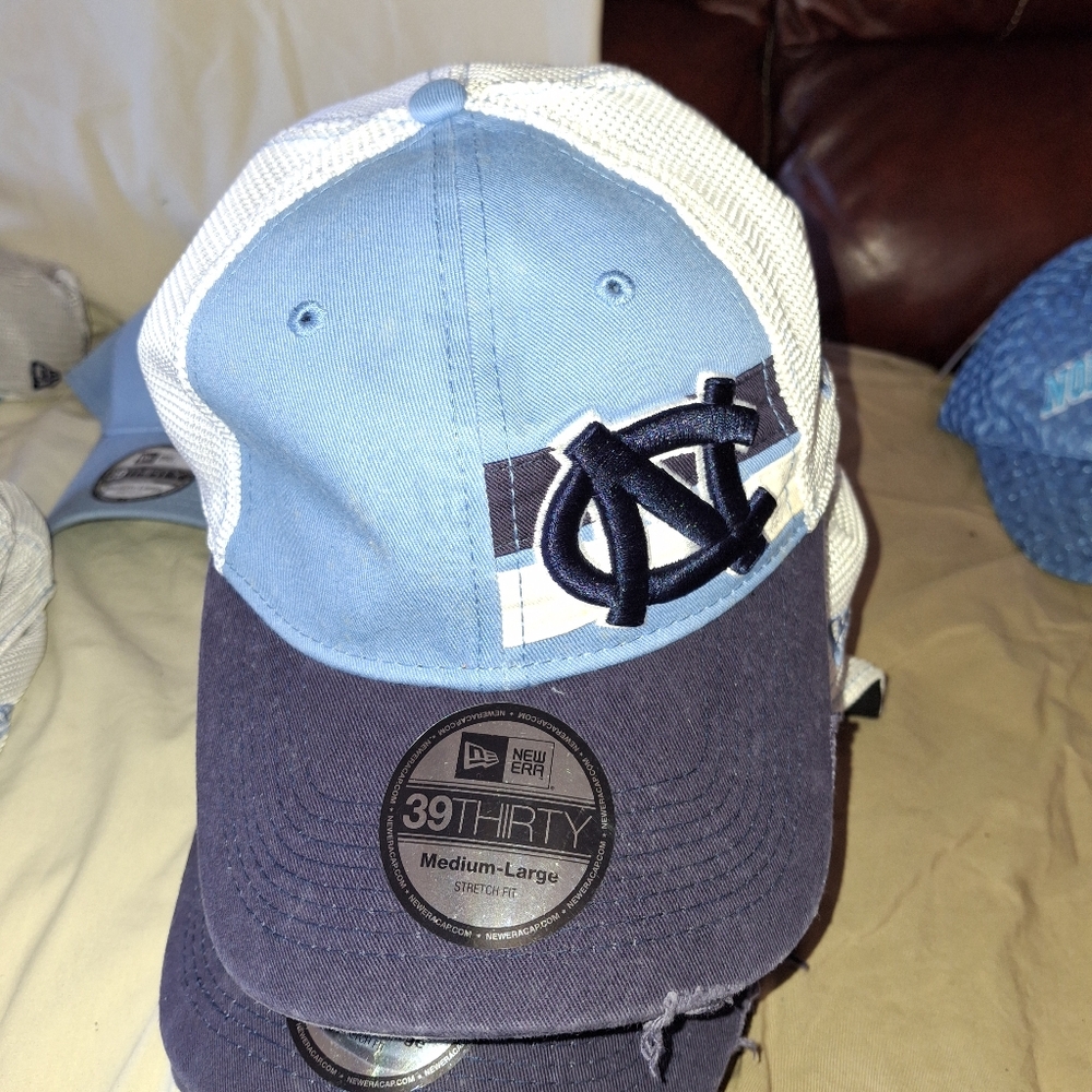 New Era M-L UNC Tarheel ball caps.